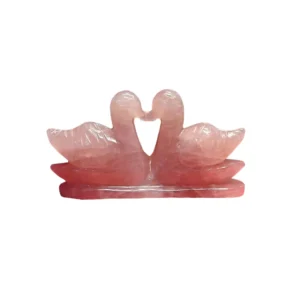 Lab certified AAA grade natural Rose Quartz swan pair on a white background, used for Feng Shui love and relationship healing by Divinity Crystals.