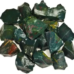 A large pile of unpolished, raw bloodstone crystal chunks isolated on a white background, showcasing a mix of deep forest green and vivid red speckled patterns.