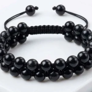 Handmade double-row black touramaline crystal beaded bracelet featuring polished black beads woven with sky black adjustable macrame thread, shown on a white background
