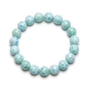 Top-down commercial product photograph of a natural, premium gem-grade Larimar 10mm beaded bracelet made of approximately nineteen (19) medium-sized, perfectly round beads on a pure #FFFFFF white background. The 10mm beads showcase a natural greenish-blueish (seafoam, pale aqua-blue, and turquoise-tinted blue) color palette, heavily marbled with natural wave-like and web-like white patterns, entirely free of brown, red, or dark blemishes. Captures the stone's semi-translucent, glass-like luster and highly polished finish, reflecting natural light for Throat Chakra healing and tranquility.
