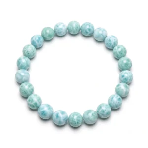 Top-down commercial product photograph of a natural, premium gem-grade Larimar 7mm beaded bracelet made of approximately twenty-six (26) small, perfectly round beads on a pure #FFFFFF white background. The delicate 7mm beads showcase a natural greenish-blueish (seafoam, pale aqua-blue, and turquoise-tinted blue) color palette, heavily marbled with natural wave-like and web-like white patterns (completely free of brown, red, or dark marks). Captures the stone's semi-translucent, glass-like luster and highly polished finish, reflecting natural light for Throat Chakra healing and tranquility.