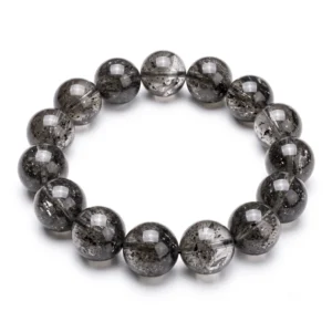 Top-down commercial product photograph of a natural dark grey Herkimer Quartz (Herkimer Diamond) 13.5mm beaded bracelet made of fifteen (15) chunky, perfectly round beads on a pure #FFFFFF white background. The large beads showcase natural dark-grey, smoky-charcoal and black carbon (anthraxolite) inclusions, tiny shimmering fractures, and internal veils that create a gritty, organic, yet glass-like dark grey depth, highlighting their unique natural character and high-quality large-scale polish.
