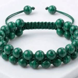 Handmade double-row natural malachite crystal beaded bracelet featuring polished malachite beads woven with adjustable green thread, shown on a white background