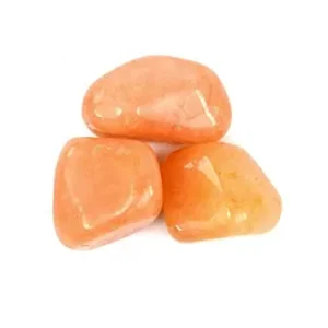 Three smooth, high-gloss natural Red Aventurine tumbled stones arranged in a triangle on a pure white background, showcasing warm coral-red and tangerine quartz translucency with natural mineral flecks for Root and Sacral Chakra vitality.