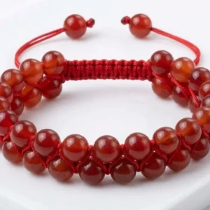 Handmade double-row natural red carnelian crystal beaded bracelet featuring polished red carnelian beads woven with adjustable red thread, shown on a white background