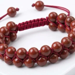 Handmade double-row natural red jasper crystal beaded bracelet featuring polished red jasper beads woven with adjustable red thread, shown on a white background