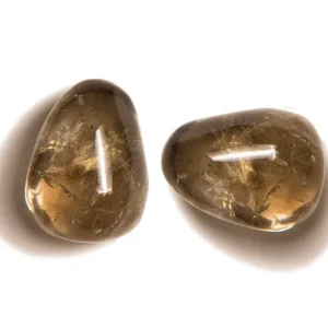 Macro close-up of two translucent natural Smoky Quartz tumbled stones isolated on a seamless white background, highlighting golden-brown internal crystal veils and high-luster tumble polish.